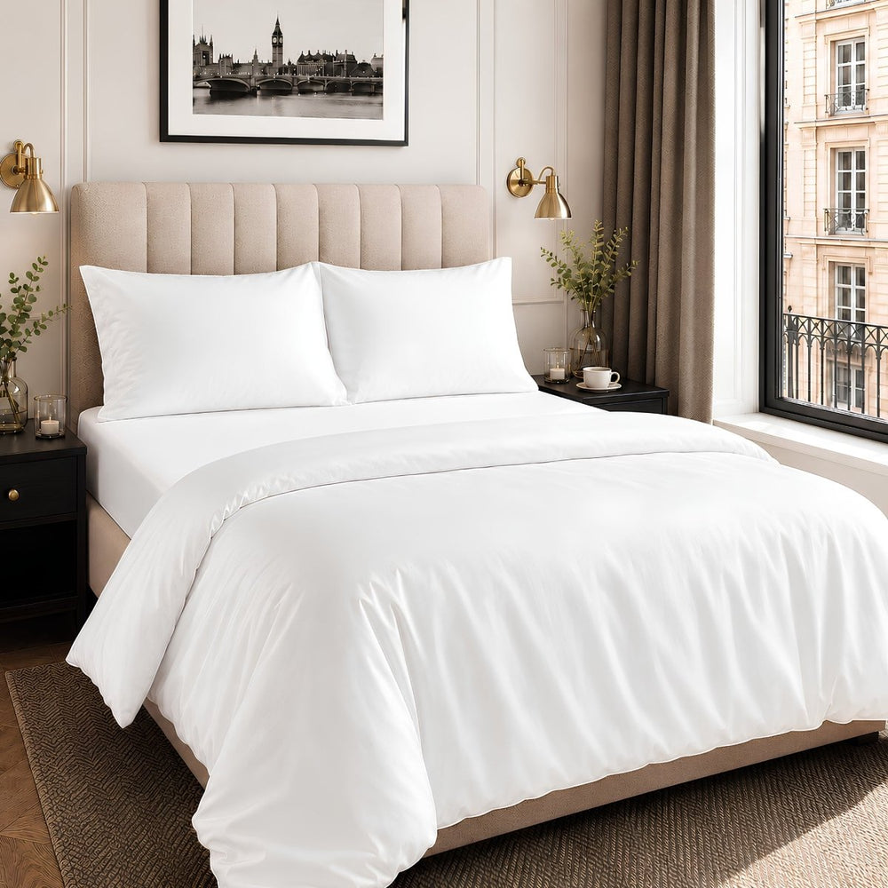 A bed made with white Ackly Bamboo bedding